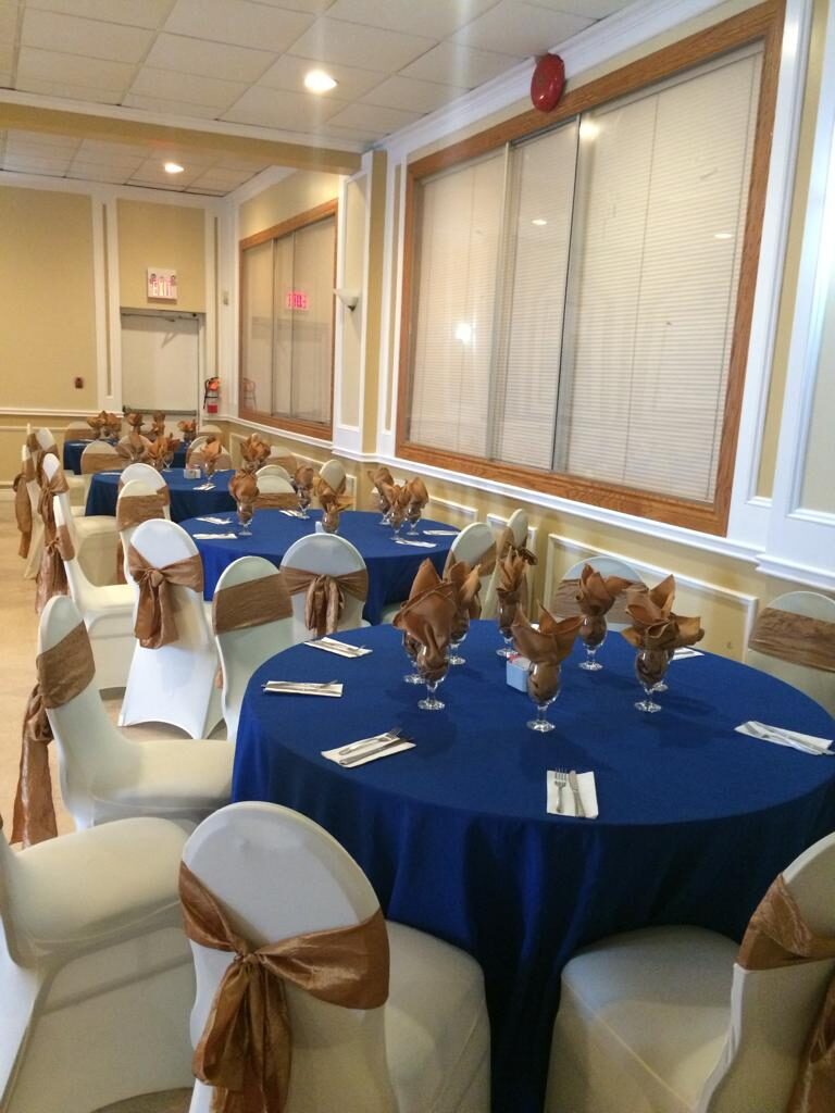 Blue linens with gold chair sashes